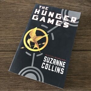 The Hunger Games by Suzanne Collins paperback book